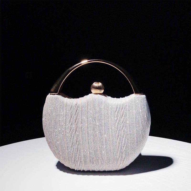 Elegant Handbag with Luxury Round Handle and Spacious Interior