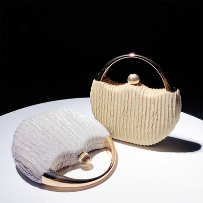 Elegant Handbag with Luxury Round Handle and Spacious Interior