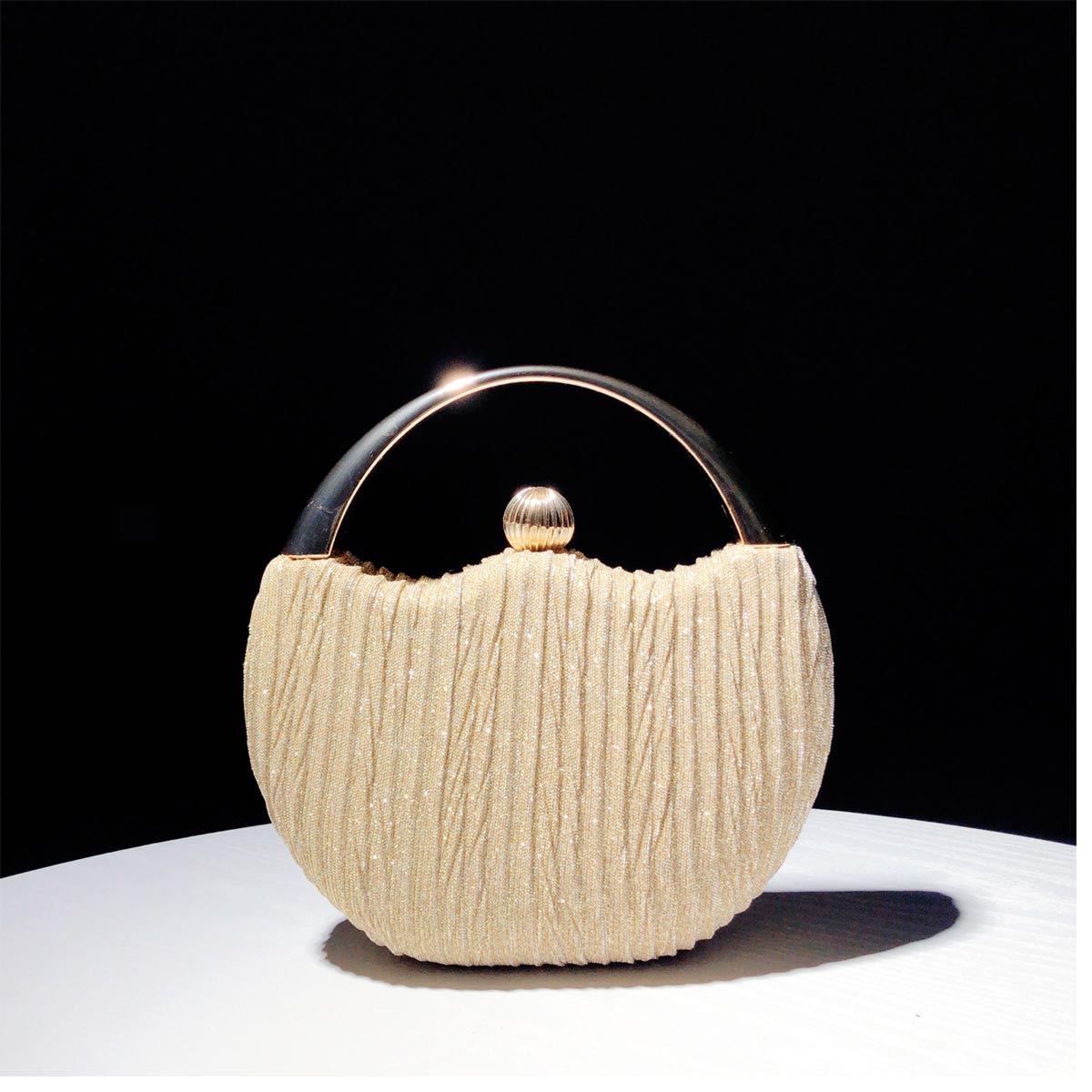 Elegant Handbag with Luxury Round Handle and Spacious Interior