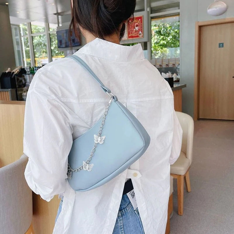 Women’s Stylish Crossbody Shoulder Bag with Zipper Pocket and Butterfly Chain Accent